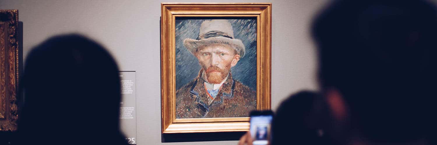People taking a photo of a Van Gough.